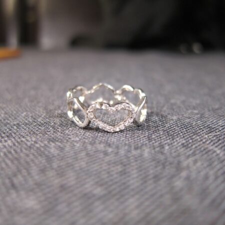 Cute little sterling silver linked hearts band ring white stones signed tested 7