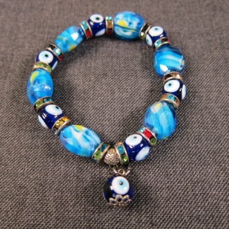 Cute hand blown glass bead stretch bracelet blues swirls and eyeballs! small