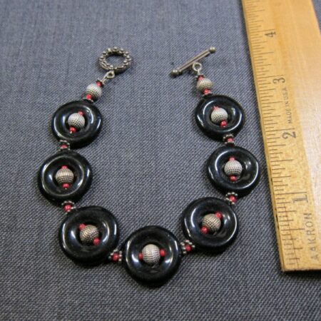 Gorgeous handmade bracelet black glass circles textured sterling silver balls 8"