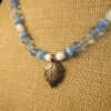 Gorgeous blue white glass beaded necklace w/sterling silver leaf pendant 18"