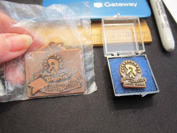 Set of vintage Arizona Charlie's Las Vegas Casino pin and keychain copper-tone