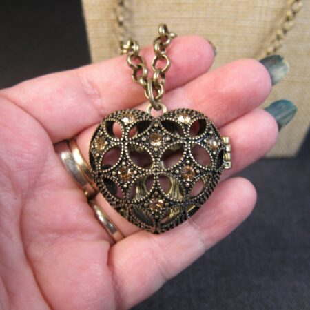 Gorgeous brass-tone openwork heart locket necklace by Lane Bryant opens hinged