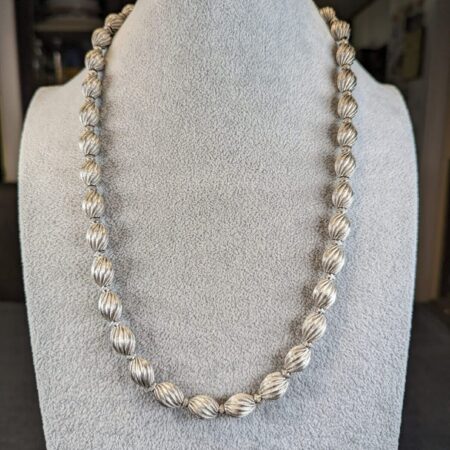 Gorgeous vintage Monet 24" textured silver-tone bead necklace strung on chain