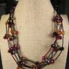Beautiful unusual Chico's necklace black metal red orange black glass beads