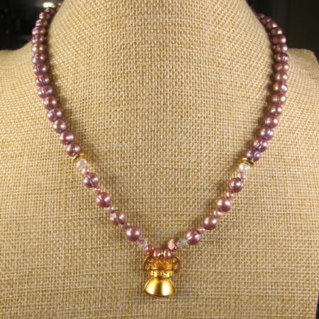 Beautiful lavender real pearls TOYO Los Angeles w/gold-tone Aztec/Mayan pendant