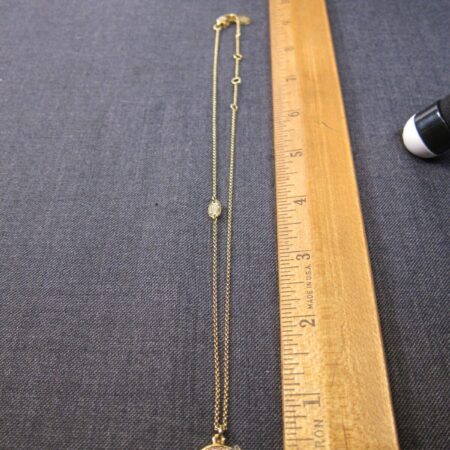 Cute Juicy Couture gold-tone 18" necklace w/small rainbow pendant