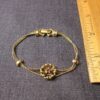Sweet vintage Goldette gold-tone bracelet with purple rhinestone flower