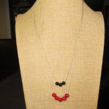 Beautiful two-tiered 20" long sterling silver necklace w/coral & onyx beads