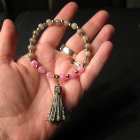 Cute pink and gray stone bead stretch bracelet w/ gray tassel gold tone beads