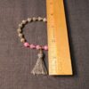 Cute pink and gray stone bead stretch bracelet w/ gray tassel gold tone beads - Image 2