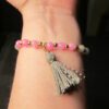 Cute pink and gray stone bead stretch bracelet w/ gray tassel gold tone beads - Image 4