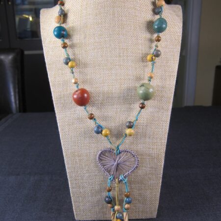 Cute multi-color seeds and wooden beads on cord necklace w/ macrame purple heart