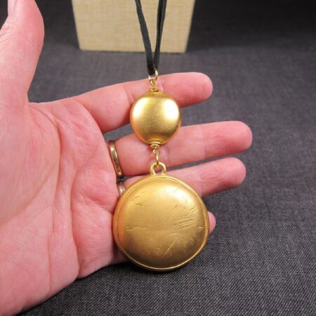 Lovely vintage Liz Claiborne matte gold-tone pendant long black cord necklace