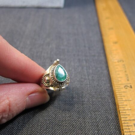 Gorgeous sterling silver green gemstone poison ring size just under a 7.