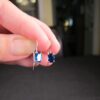 Gorgeous small .8g 14K white gold earrings with blue CZ stone